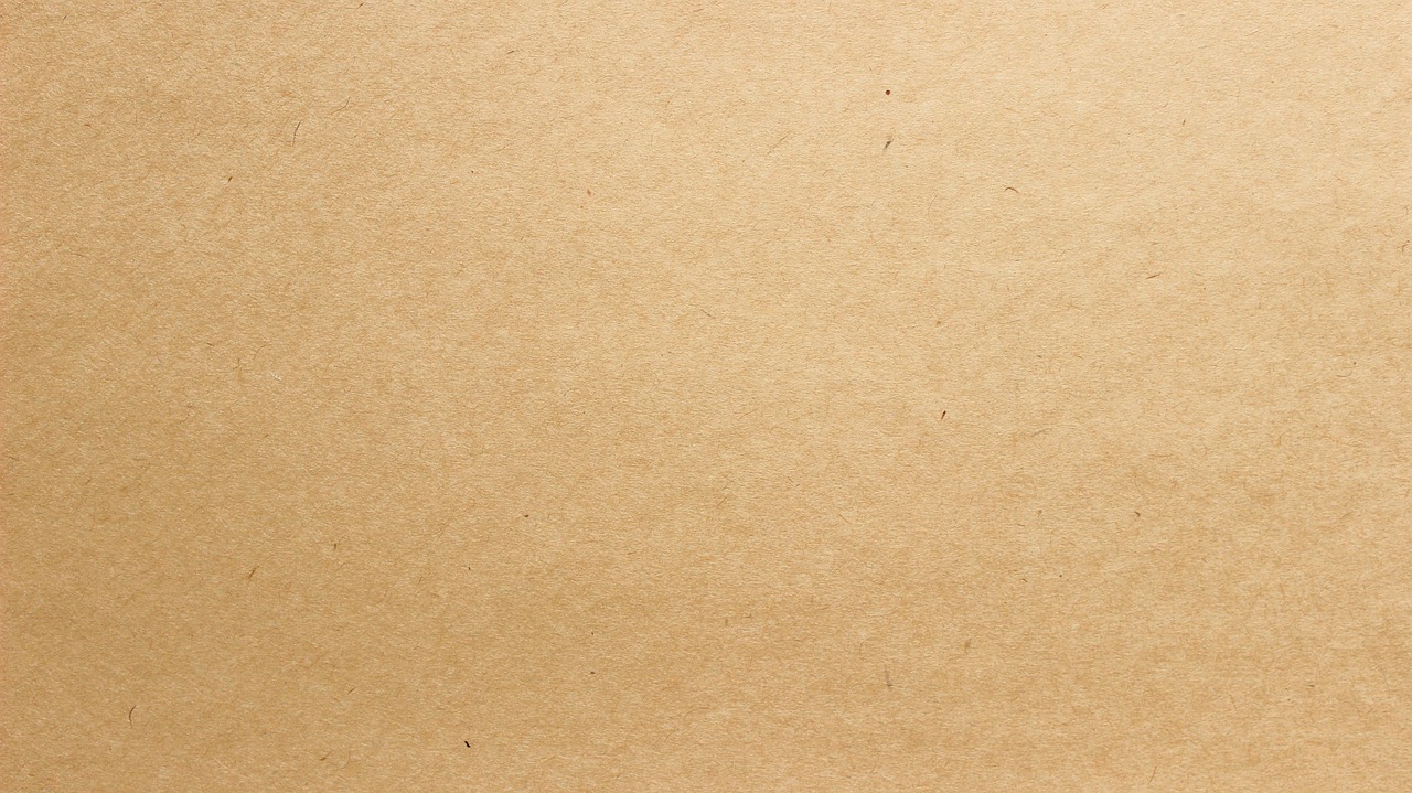 Plain kraft paper bags stacked flat